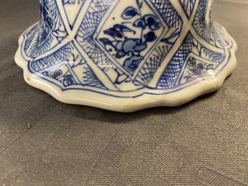 A large Chinese blue and white five-piece garniture with floral and landscape panels, Kangxi