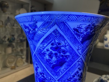 A large Chinese blue and white five-piece garniture with floral and landscape panels, Kangxi