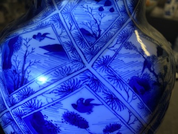 A large Chinese blue and white five-piece garniture with floral and landscape panels, Kangxi