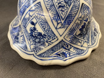 A large Chinese blue and white five-piece garniture with floral and landscape panels, Kangxi