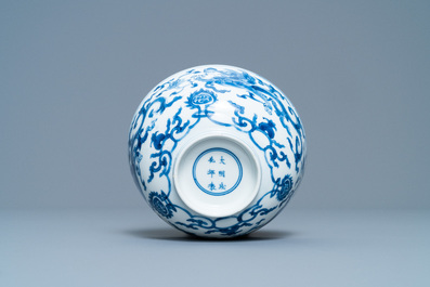 A Chinese blue and white 'dragon' bowl with a double vajra in the centre, Chenghua mark, Kangxi