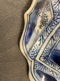 A large Chinese blue and white five-piece garniture with floral and landscape panels, Kangxi