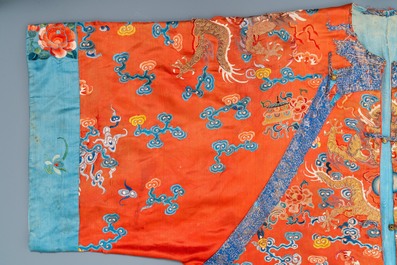 A Chinese embroidered silk red-ground 'dragon' robe, 19th C.