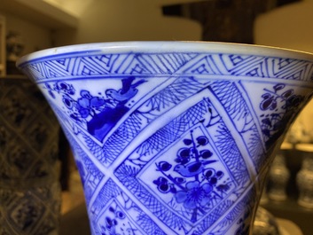 A large Chinese blue and white five-piece garniture with floral and landscape panels, Kangxi