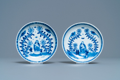 A pair of Chinese blue and white 'Caritas' cups and saucers, Kangxi/Yongzheng