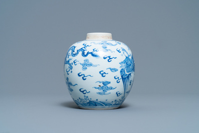 A Chinese blue and white 'dragon and phoenix' jar with wooden lid, Chenghua mark, Kangxi