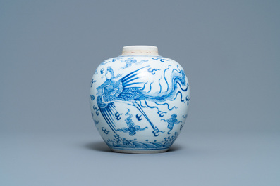A Chinese blue and white 'dragon and phoenix' jar with wooden lid, Chenghua mark, Kangxi