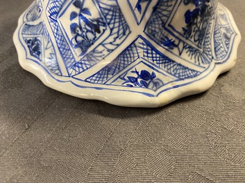 A large Chinese blue and white five-piece garniture with floral and landscape panels, Kangxi