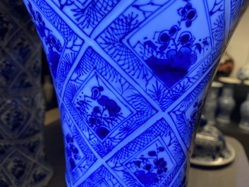A large Chinese blue and white five-piece garniture with floral and landscape panels, Kangxi