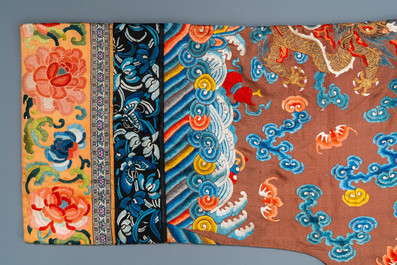 A Chinese embroidered silk brown-ground 'dragon' robe, 18/19th C.