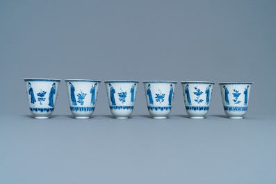 Six large Chinese blue and white cups and five saucers, Yu mark, Kangxi