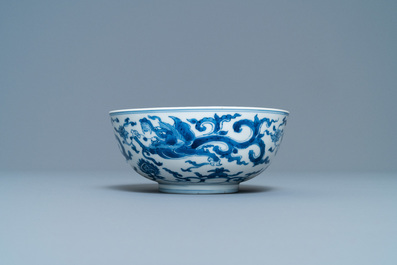 A Chinese blue and white 'dragon' bowl with a double vajra in the centre, Chenghua mark, Kangxi