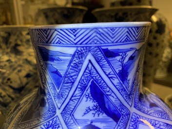 A large Chinese blue and white five-piece garniture with floral and landscape panels, Kangxi