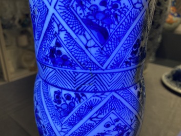 A large Chinese blue and white five-piece garniture with floral and landscape panels, Kangxi