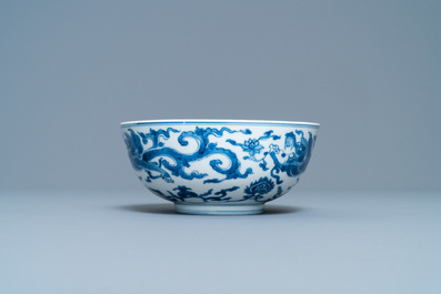 A Chinese blue and white 'dragon' bowl with a double vajra in the centre, Chenghua mark, Kangxi