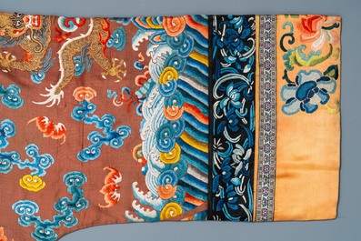A Chinese embroidered silk brown-ground 'dragon' robe, 18/19th C.