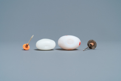 A Chinese white jade coral-topped snuff bottle and one in glass with inclusions, 19th C.