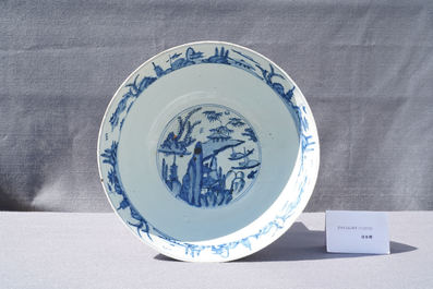 A large Chinese blue and white 'river landscape' bowl, Ming