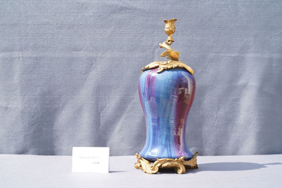 A Chinese flamb&eacute;-glazed vase with gilt bronze candelabra mount, 19th C.