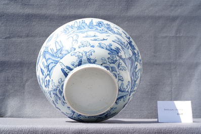 A large Chinese blue and white 'river landscape' bowl, Ming