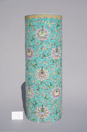A large Chinese famille rose cylindrical vase with molded lotus scrolls, Jiaqing/Daoguang