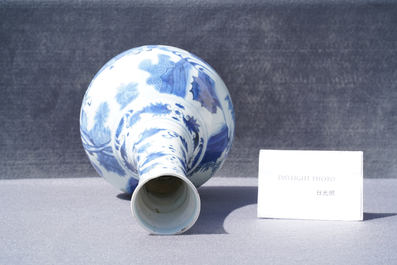 A Chinese blue and white bottle vase with figures in a landscape, Transitional period