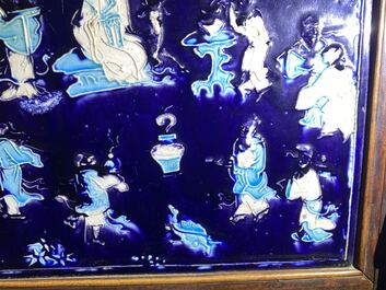 A Chinese square fahua plaque mounted in a wooden table screen, Ming