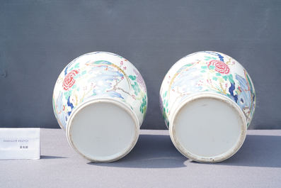 A pair of Chinese famille rose 'pheasants' vases and covers, 19th C.