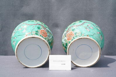 A pair of Chinese turquoise-ground famille verte vases and covers, 19th C.