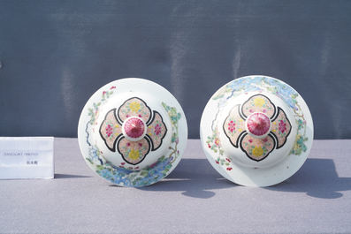 A pair of Chinese famille rose 'pheasants' vases and covers, 19th C.