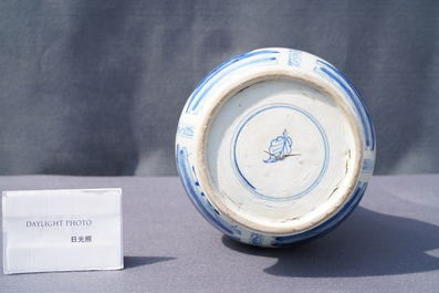 A Chinese blue and white bottle vase with flower arrangements, Kangxi