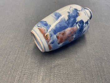 A small Chinese blue, white and copper-red vase, 19th C.