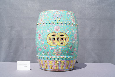 A pair of Chinese turquoise-ground famille rose garden seats, 19th C.