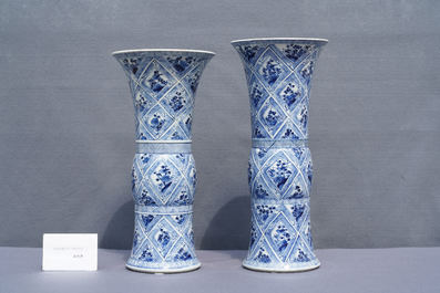 A large Chinese blue and white five-piece garniture with floral and landscape panels, Kangxi