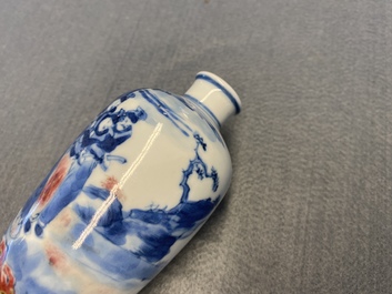 A small Chinese blue, white and copper-red vase, 19th C.