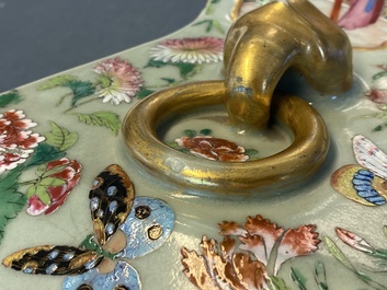 A pair of Chinese square famille rose celadon-ground vases on gilt bronze feet, 19th C.