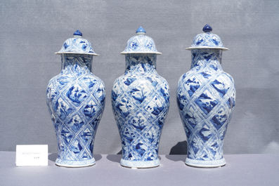 A large Chinese blue and white five-piece garniture with floral and landscape panels, Kangxi