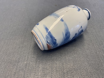 A small Chinese blue, white and copper-red vase, 19th C.
