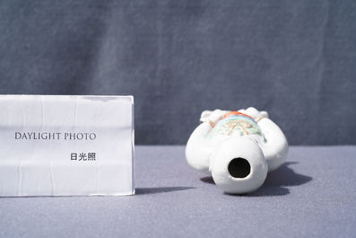 A Chinese famille verte water dropper modelled as a peeing boy, Qianlong