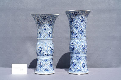 A large Chinese blue and white five-piece garniture with floral and landscape panels, Kangxi