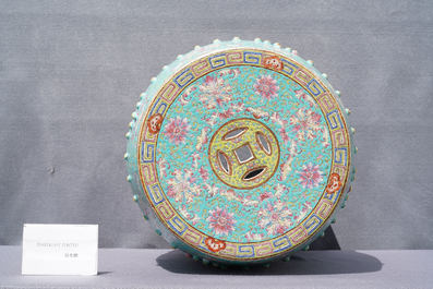 A pair of Chinese turquoise-ground famille rose garden seats, 19th C.