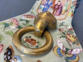 A pair of Chinese square famille rose celadon-ground vases on gilt bronze feet, 19th C.