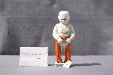 A Chinese famille verte water dropper modelled as a peeing boy, Qianlong