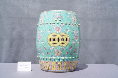 A pair of Chinese turquoise-ground famille rose garden seats, 19th C.