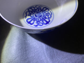 A Chinese blue and white 'dragon' bowl with a double vajra in the centre, Chenghua mark, Kangxi