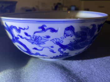 A Chinese blue and white 'dragon' bowl with a double vajra in the centre, Chenghua mark, Kangxi