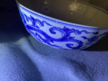 A Chinese blue and white 'dragon' bowl with a double vajra in the centre, Chenghua mark, Kangxi