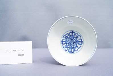 A Chinese blue and white 'dragon' bowl with a double vajra in the centre, Chenghua mark, Kangxi