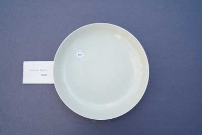 A Chinese monochrome celadon underglaze 'dragon' dish, Qianlong/Jiaqing
