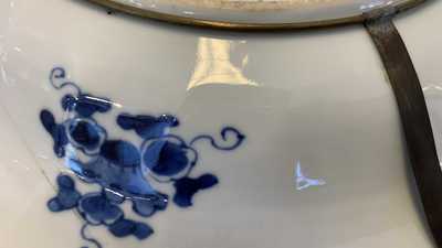 Eighteen Chinese blue and white saucers, seven cups, two dishes and a tea caddy, Kangxi/Qianlong